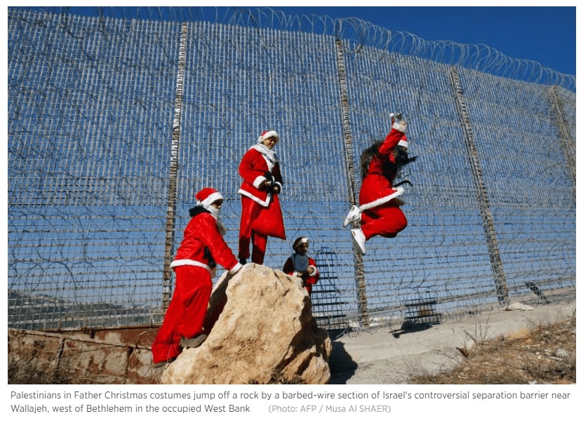 Picture 3: Palestinians protesting by the security barrier