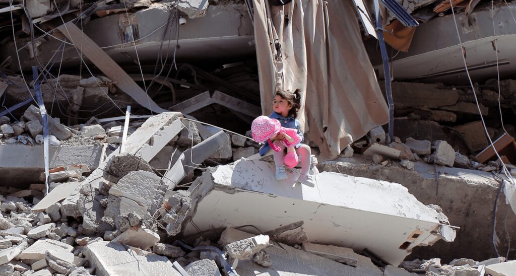 BBC Propaganda Highlights Image of Gaza Girl Posing on Rubble of Tower…That Belonged to Hamas