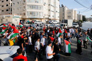 Waving Palestinian flags in Beit Hanina after the death of Shireen Abu Akleh Photo by Jamal Awad/Flash90